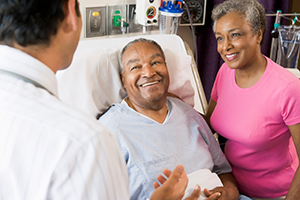 Husband in Hospital Bed Being Treated for Atrial Septal Defect